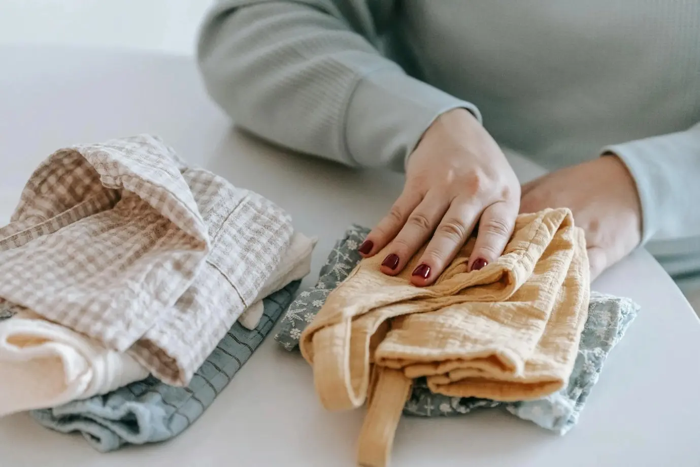 woman folding clothes