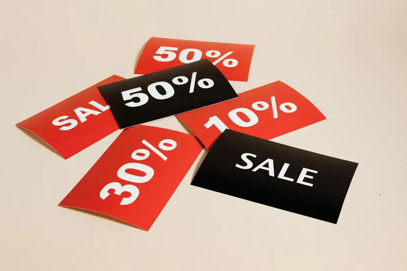 Sale cards on beige background Sale cards on beige background
