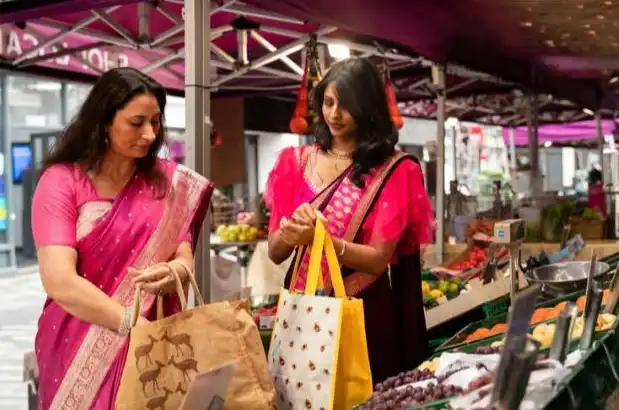 Two ladies shopping in a local market Two ladies shopping in a local market