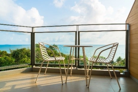 Seating in a balcony with a sea view Seating in a balcony with a sea view