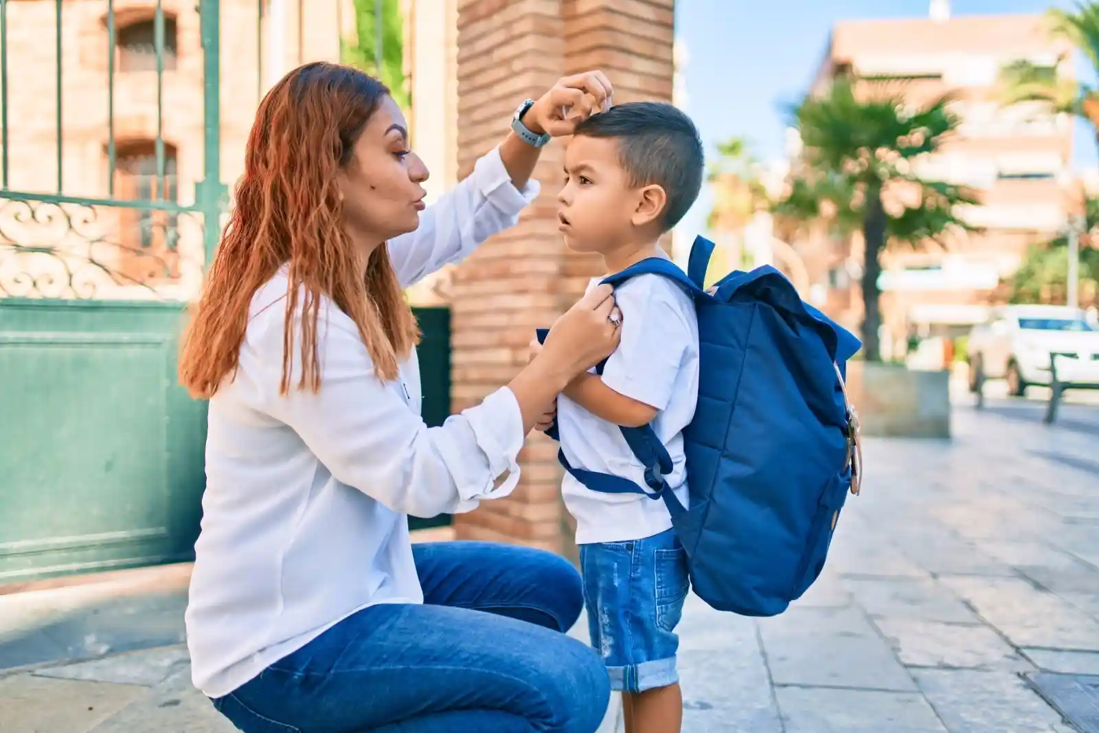 Mother sending her son to school.