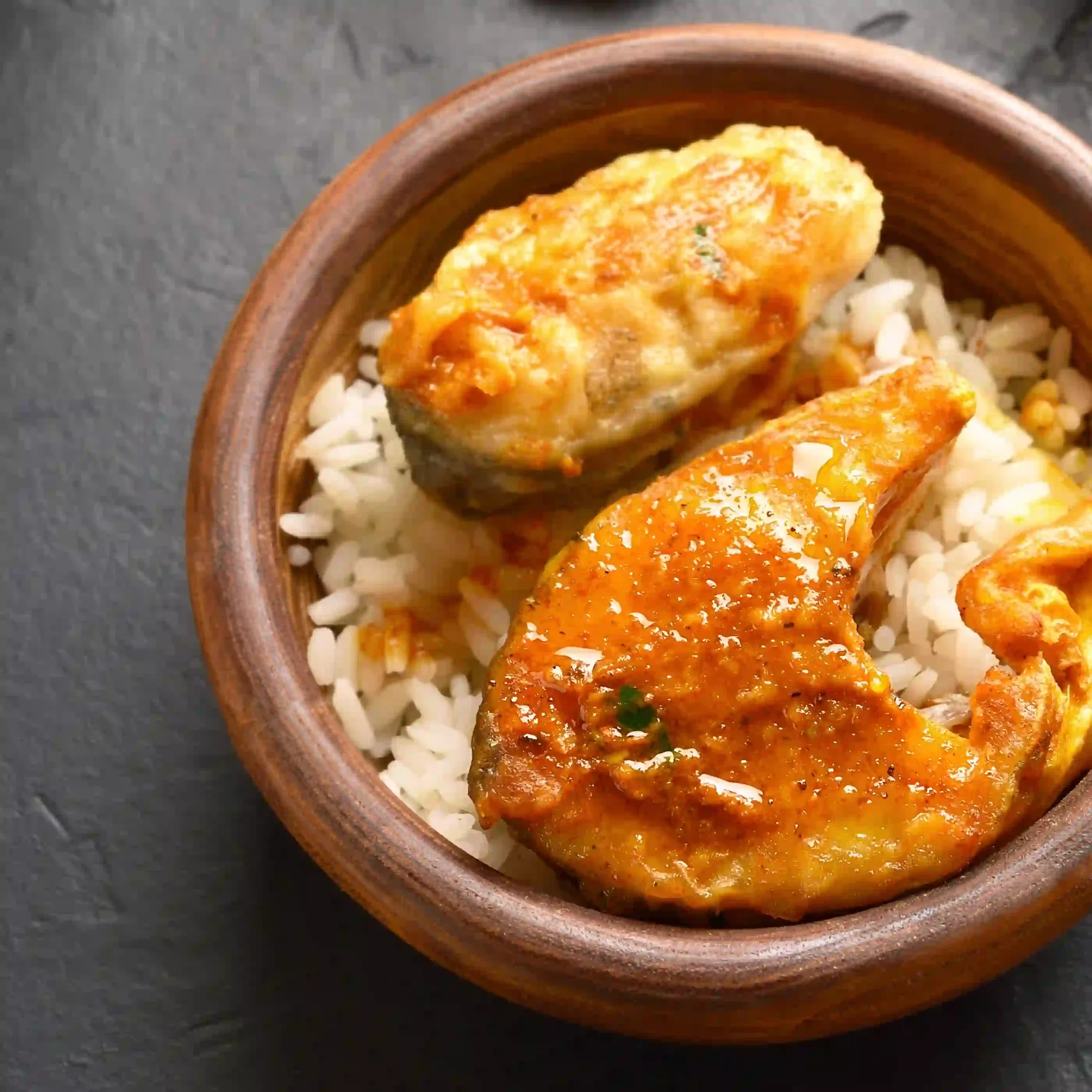 Goa’s staple food, fish curry rice in a bowl.