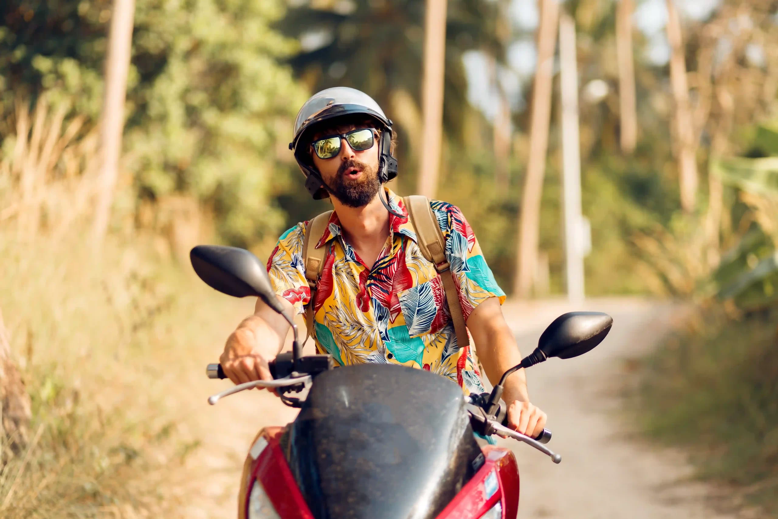 Man sitting on a motorcycle and travelling in Goa.