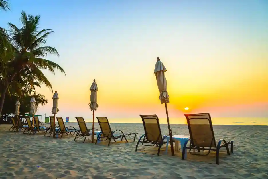 Beach chairs laid out on a beach in Goa.
