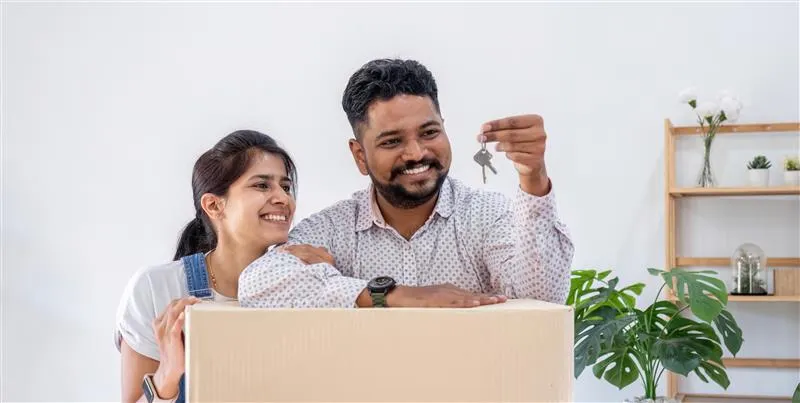 A happy couple starting fresh in a new home in Goa.