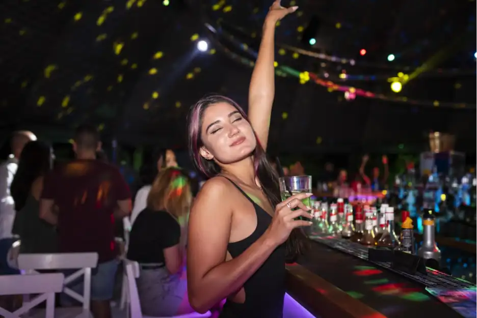 A woman enjoying herself at a club in Goa