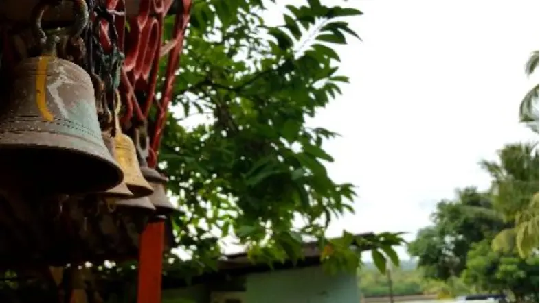 Temple bells reflecting the cultural harmony and serene lifestyle around a property in Goa.