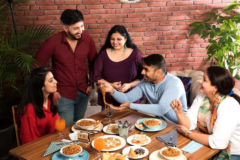 People hanging out with their friends at their home in Goa.