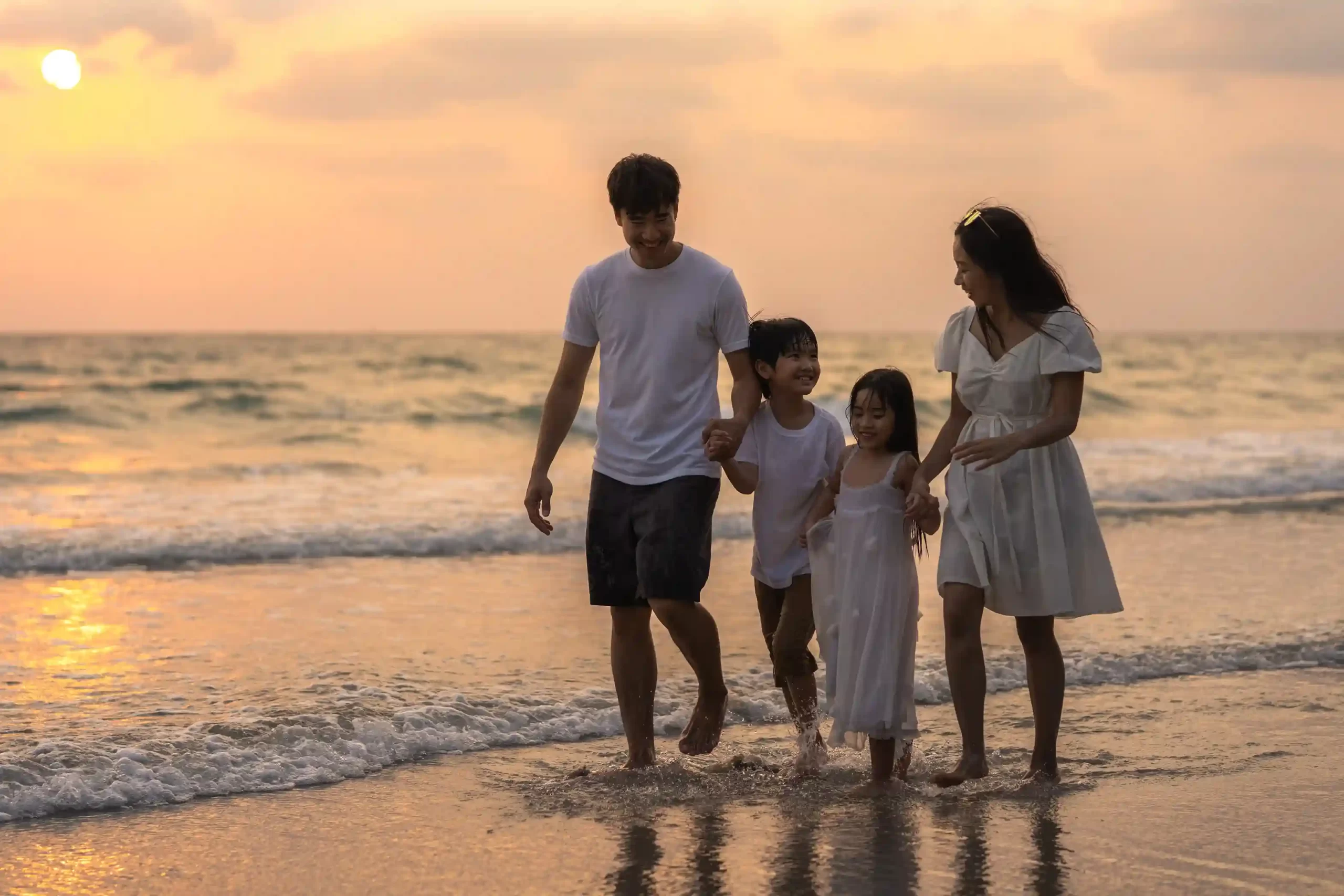 A family enjoying themselves at a beach near a home in Goa.