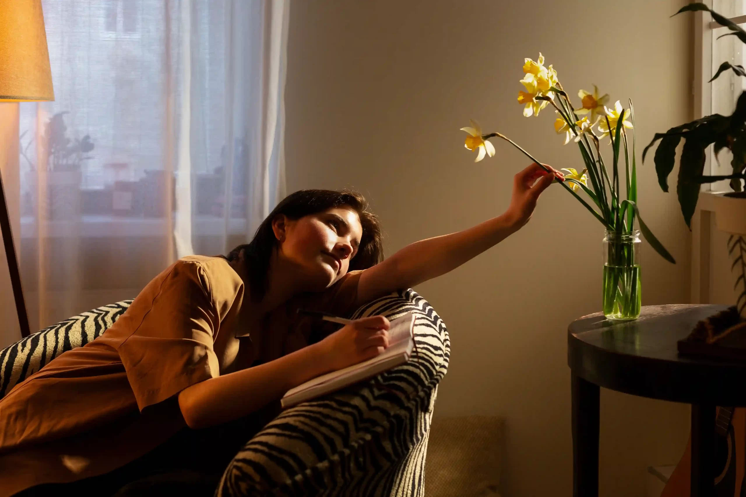 Woman relaxing at a home in Panjim while enjoying a calm space.<br /> 